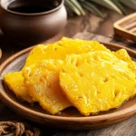 A plate of Taiwanese pineapple cakes with tea.